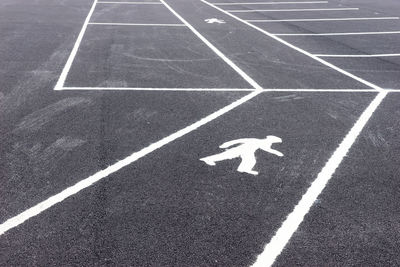 High angle view of arrow symbol on road