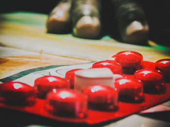 Close-up of red chili peppers on table