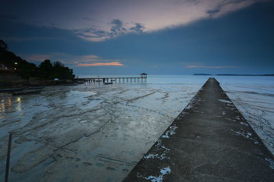 Scenic view of sea against sky at sunset