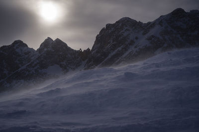 Scenic view of mountains against sky during winter