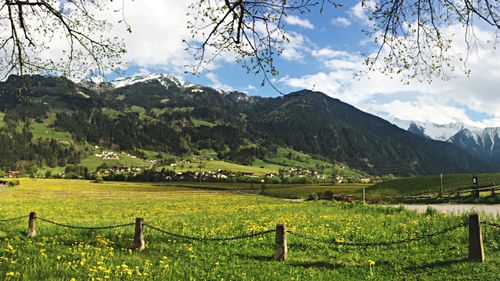 Scenic view of landscape against cloudy sky