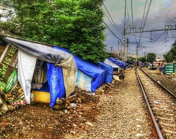 Woman standing on railroad track