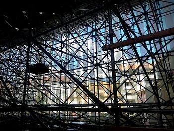 Low angle view of silhouette building against sky