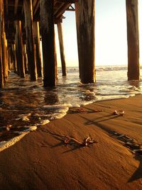 View of wooden pier on beach