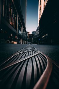 Surface level of road amidst buildings in city