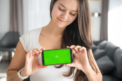 Young woman using digital tablet