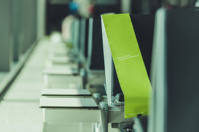 Please keep distance airport waiting room seats information for travellers. 