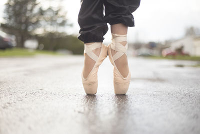 Low section of ballet dancer outdoors