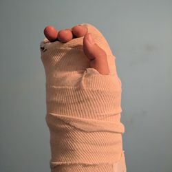 Close-up of hand with bandage