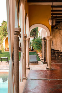 Rear view of woman standing in historic building