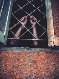 Low angle view of man standing on wall