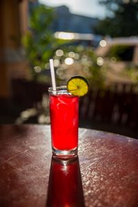 Close-up of red wineglass on table