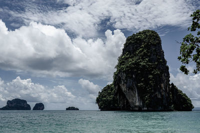 Scenic view of rocks in sea against sky