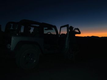 Vintage car against clear sky during sunset