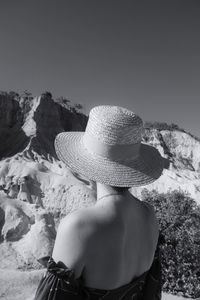 Rear view of woman wearing hat against sky