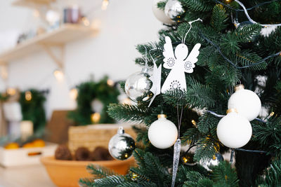 White christmas toys on the christmas tree close-up with copy space