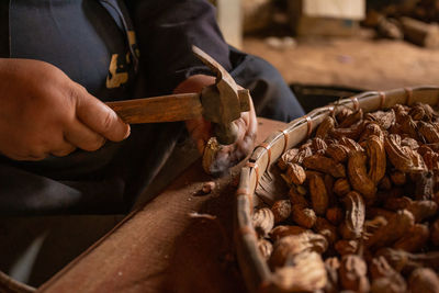 Midsection of man preparing food on table