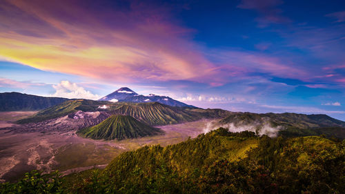 View of volcanic landscape against cloudy sky