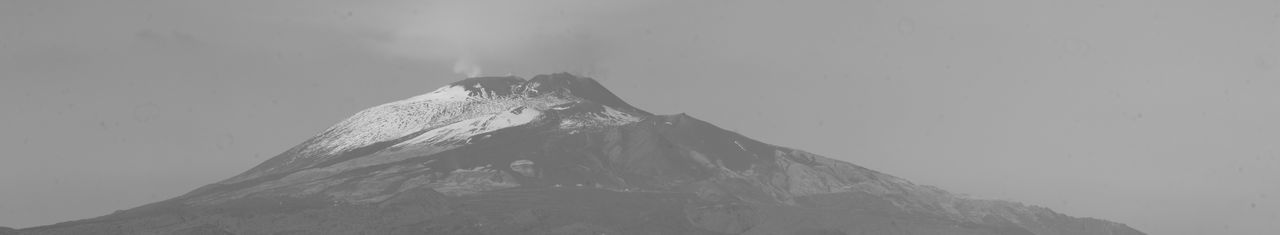 Scenic view of snowcapped mountain against sky