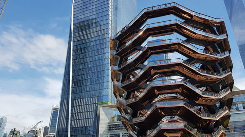 Low angle view of modern buildings against sky