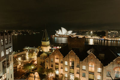 High angle view of illuminated buildings in city at night