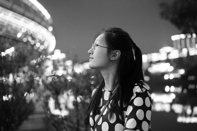 Portrait of young woman looking away