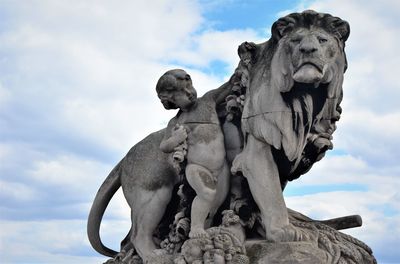 Low angle view of statue against sky