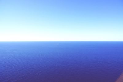 Scenic view of calm sea against clear sky