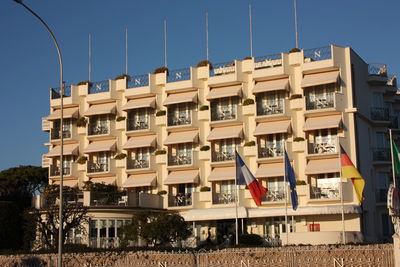 Low angle view of residential buildings against blue sky