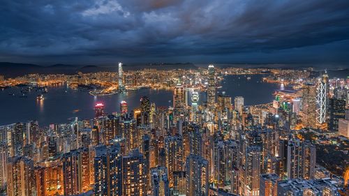 High angle view of illuminated city buildings at night