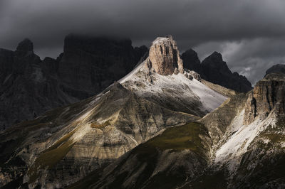 Rocky mountains against clouds