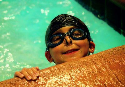 High angle view of boy swimming in pool