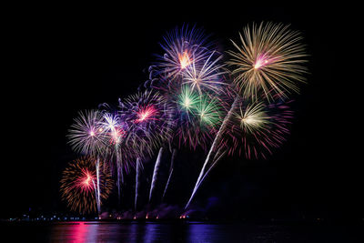 Colorful fireworks of various colors at night with celebration and anniversary concept.