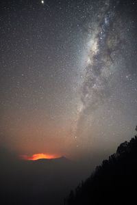 Scenic view of star field against sky at night