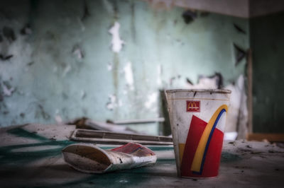 Close-up of old shoes on table