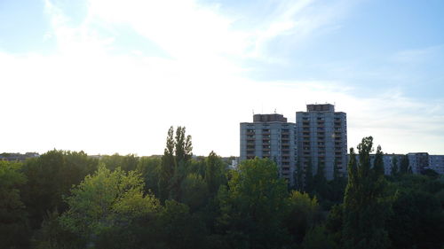 View of buildings against cloudy sky