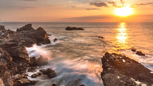 Scenic view of sea against sky during sunset