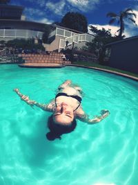 Man swimming in pool