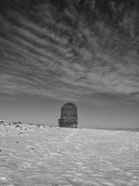 Building by sea against sky