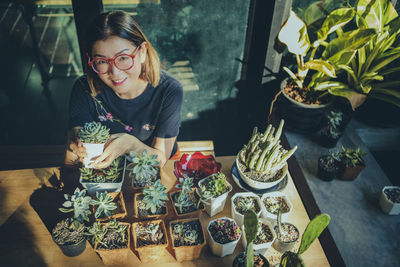 Woman smiling with food on table