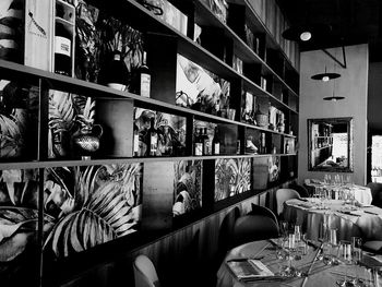 Empty chairs and tables in restaurant