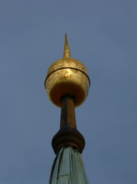 Low angle view of bell tower against blue sky