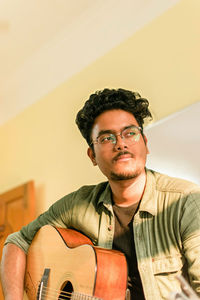 Young man playing guitar