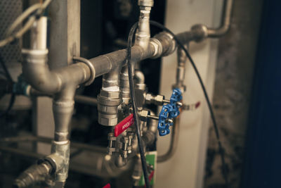 Close-up of pipes against wall