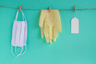 Clothes hanging on clothesline against blue sky