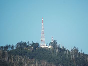 Low angle view of tower against clear blue sky