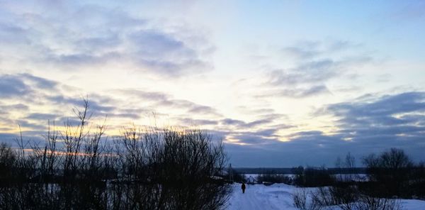 Scenic view of lake against sky during winter