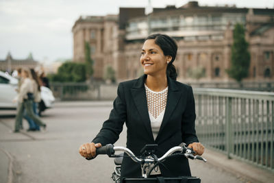 Man riding bicycle on city