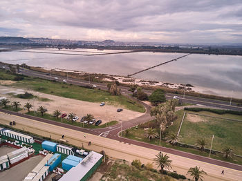 High angle view of road by river against sky