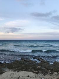 Scenic view of sea against dramatic sky